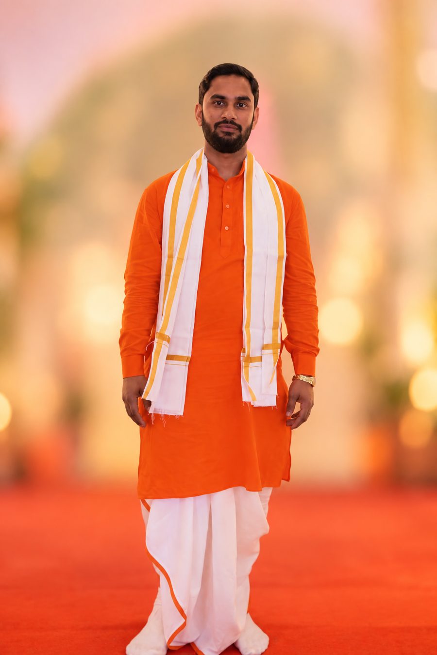 Pandit Umesh Arya in saffron kurta and dhoti