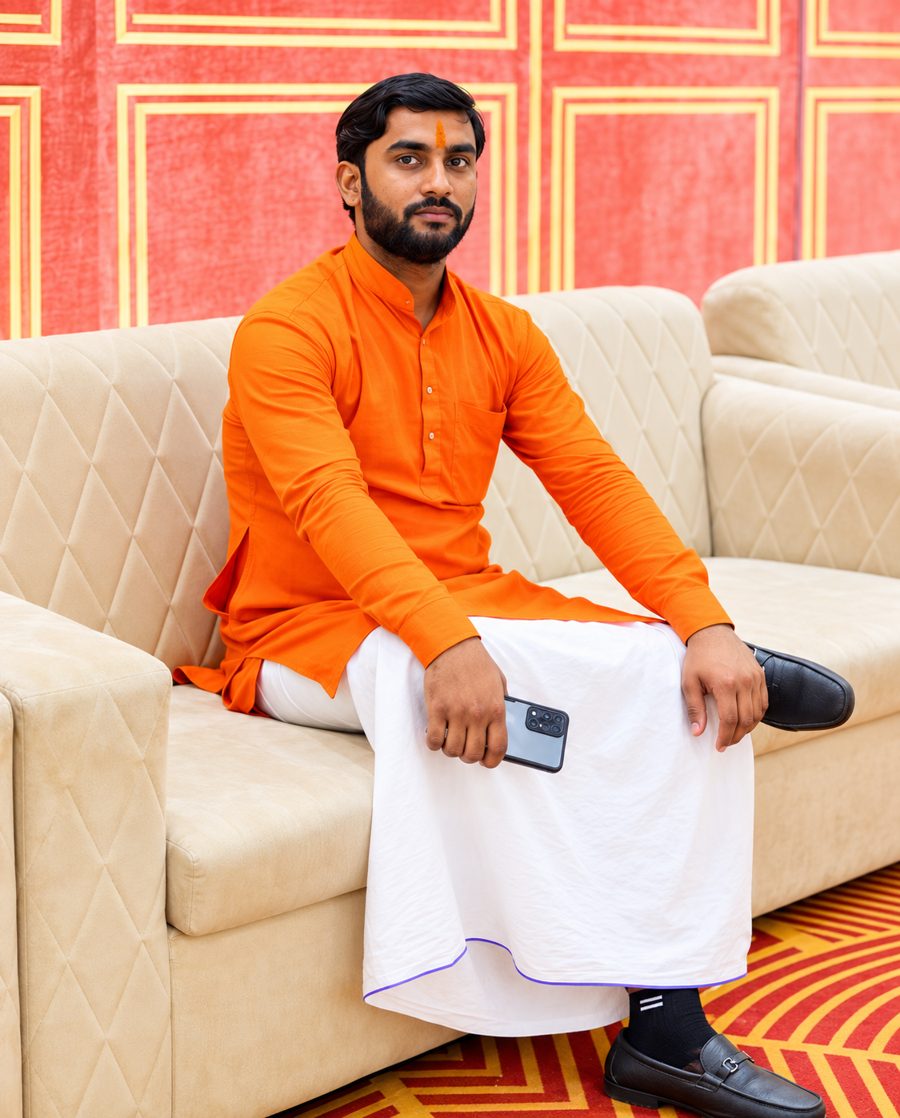 Pandit Umesh Arya in saffron kurta and dhoti